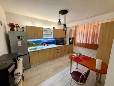 bucatarie utilata cu zona de luat masa casa Tunari Ilfov