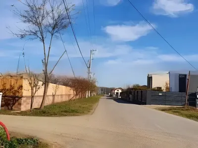 Teren de vanzare cumparare Balotești Ilfov drum neasfaltat