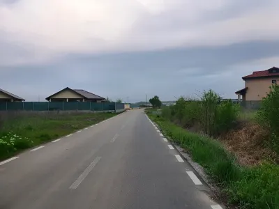 Teren de vanzare in Balotesti Ilfov drum neasfaltat camp