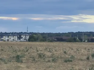 teren vanzare cumparare Balotești Ilfov cu case in fundal